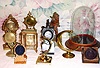 Ten (10) watch holders including gilt, gutta percha, wooden, one on marbleized base and a ten inch dome with base.