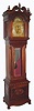 Mahogany tall case, with ball and claw feet and double columns on the hood, probably by Colonial, now with a W. H. Durfee 9-tube movement (signed on rear of rolling moon), and with Waltham signed tubes, all C.1910