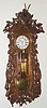 German, Carl Mueller, No. 104, Black Forest cased "Vienna Regulator", 3-wt, grand sonnerie, rod strike, in hunter motif, with rabbit, fox, 2-pheasant and a deer head, rifle and powder horn, all amongst sprays of oak branches and leaves, C.1890