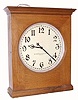 The American Clock Co., large battery powered wall clock, oak cased, with 18" dial, designed to run on two No. 6 dry cells, fitting in an alcove on top of the case, C.1905