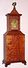 Massachusetts Shelf clock, a copy of an early Willard primitive shelf clock. This example made in 1981 by a J. Garbus using a Kilbourn and Proctor 8-day short drop rear mount weight movement. Circa 1981.