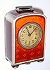 Swiss, miniature Sterling cased clock with caramel colored guilloche enamel, and a Swiss 15j stem wind movement from the base. Hallmarked and showing 'sterling' and 0.925