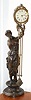 Ansonia Clock Co., New York, "JUNO" swinging arm clock, the arm moving without apparent impulse, the patinated spelter statue of the Goddess Juno, and the long canister style arm with original paper dial.