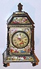 English, Wilter, London, a miniature mantle clock with a chain fusee watch movement, all the fired enamel panels of the case hand painted in Greek and Roman motif, C.1840,