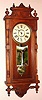 Ansonia Clock Co., "Queen Elizabeth", Victorian mahogany cased wall clock, 8-day time and gong strike wall clock. Circa 1901