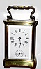 French, Brass cased carriage clock, time and alarm, cylinder 'scape, and with a travel case from a slightly larger clock. C.1900