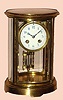 French, Vincenti for H+H, an oval cased 4-glass crystal regulator, with white porcelain dials and Arabic numerals, 8-day strike, on a gong, C.1900