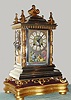 French, Japy Freres, for the Asian market, a nice architectural clock with Japanese front panel showing 2 Geisha girls in full costume, and on a gilt wooden base, 8-day time and gong strike, C.1895