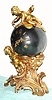 French, ball or globe clock, held aloft by one cherub, and surmounted by a second cherub with a compass in his hands, and with kimoto dragon hands, the head is the hour hand and the tail is the minute handC.1880.