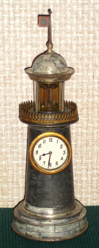 New Haven Clock Co., LIGHTHOUSE novelty, the movement in the base, and the detached balance in place of the beacon, and with glass rods to simulate the lantern, c.1889 — Antique Clocks Price Guide