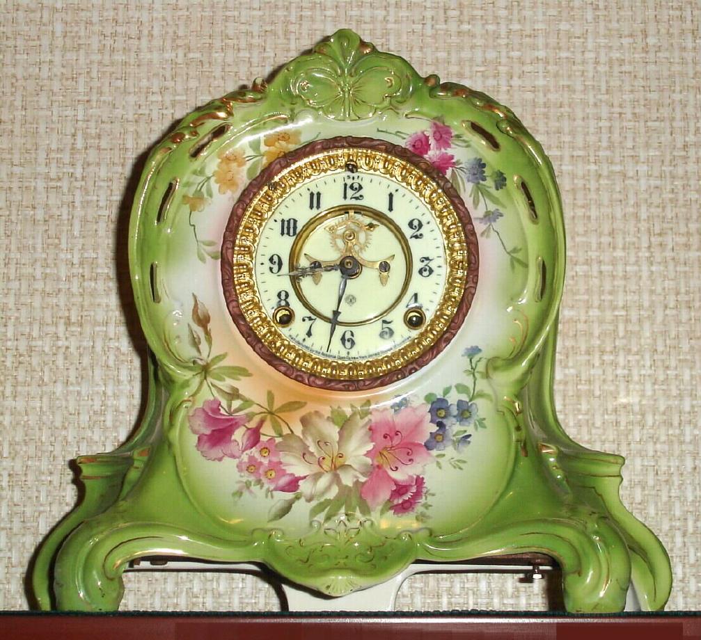 Ansonia Clock Co., Royal Bonn, "LA RIVIERE", light apple green porcelain clock in the French style, with open escapement on the dial, 8-day, gong striking. — Antique Clocks Price Guide