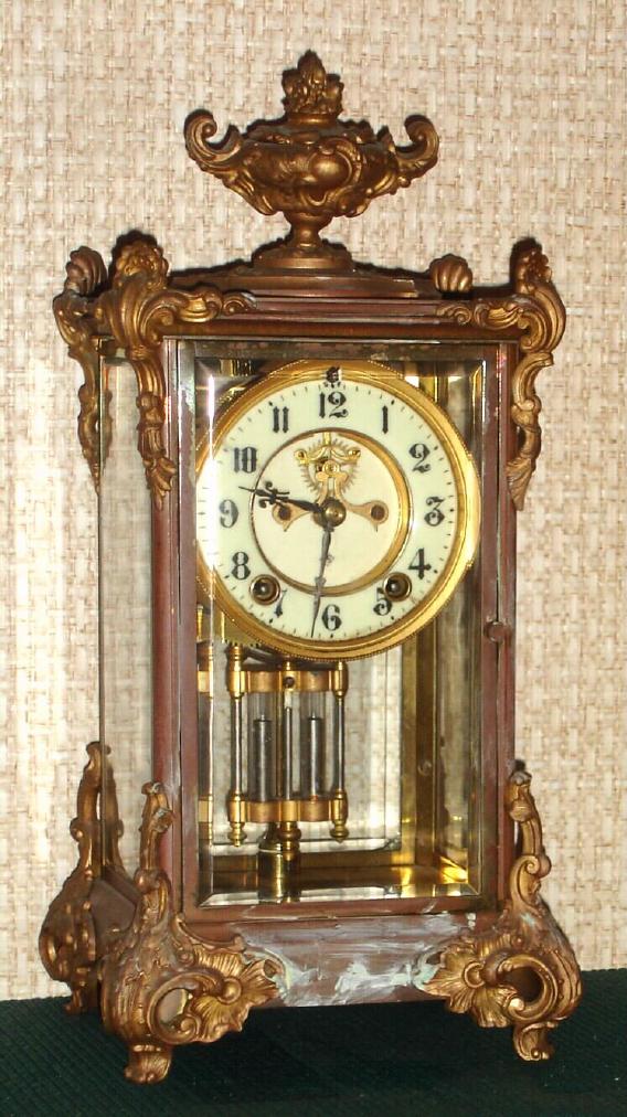 Ansonia Clock Co., New York, 4-glass Crystal Regulator, the "MARQUIS", with open escapement on porcelain dial, and French style trimmings on case, c.1904 — Antique Clocks Price Guide