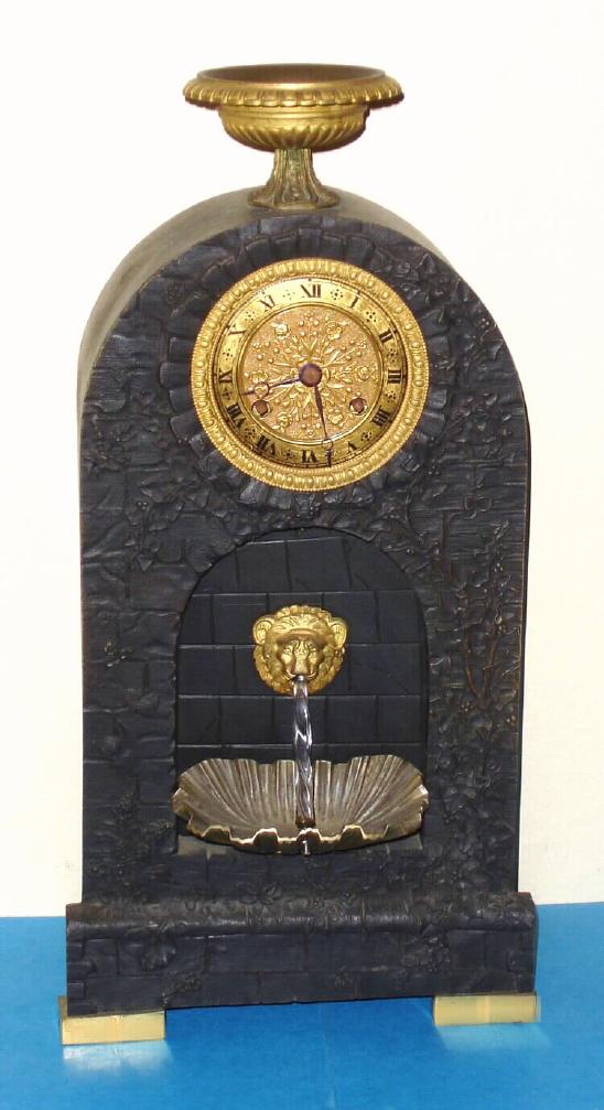 French, Waterfall Automaton, C.1840, with a small and well made silk-thread susp, bell strike movement. The twisty glass tube simulates water pouring from the lion's mouth. The automaton is a separate movement in the base of the clock, wound from the rear. — Antique Clocks Price Guide