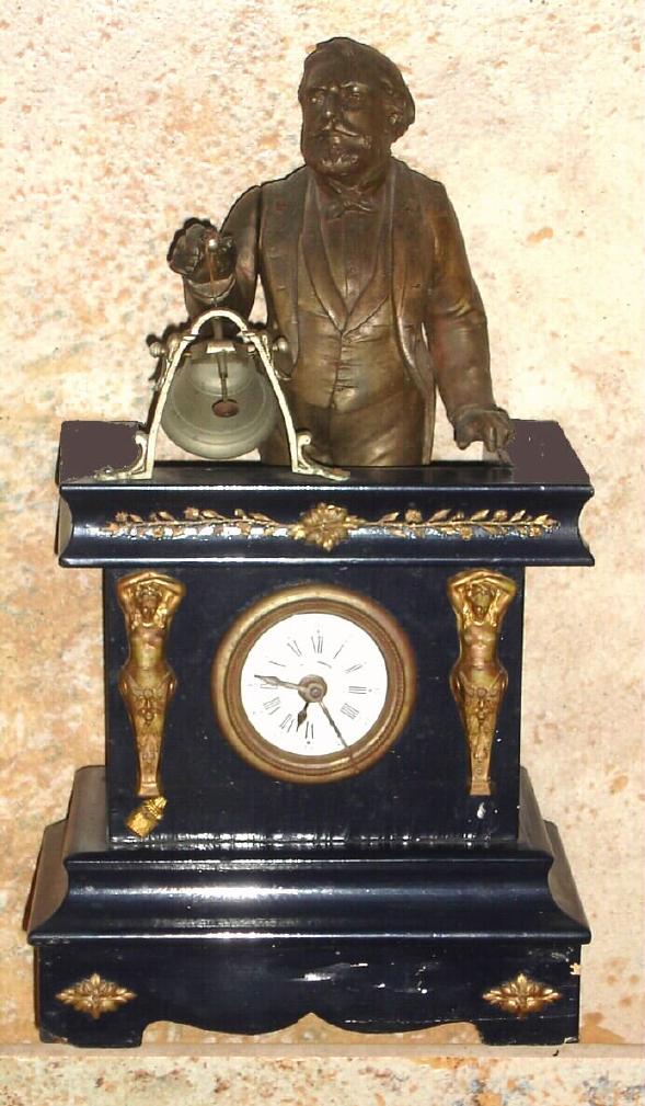 German, BELL RINGER alarm, C.1875, an ebonized pine case with pressed brass trim, and with a small back wind pendulette [short pivoted pendulum] movement. 3rd hand for alarm set on small porcelain dial. — Antique Clocks Price Guide