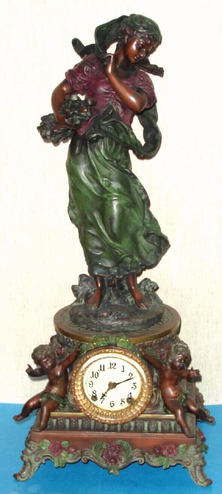 Ansonia Clock Co. New York, C.1896, "SYBIL and WINTER", cast metal figural clock with muted deco colors, 8-day time and strike with porcelain dial. — Antique Clocks Price Guide