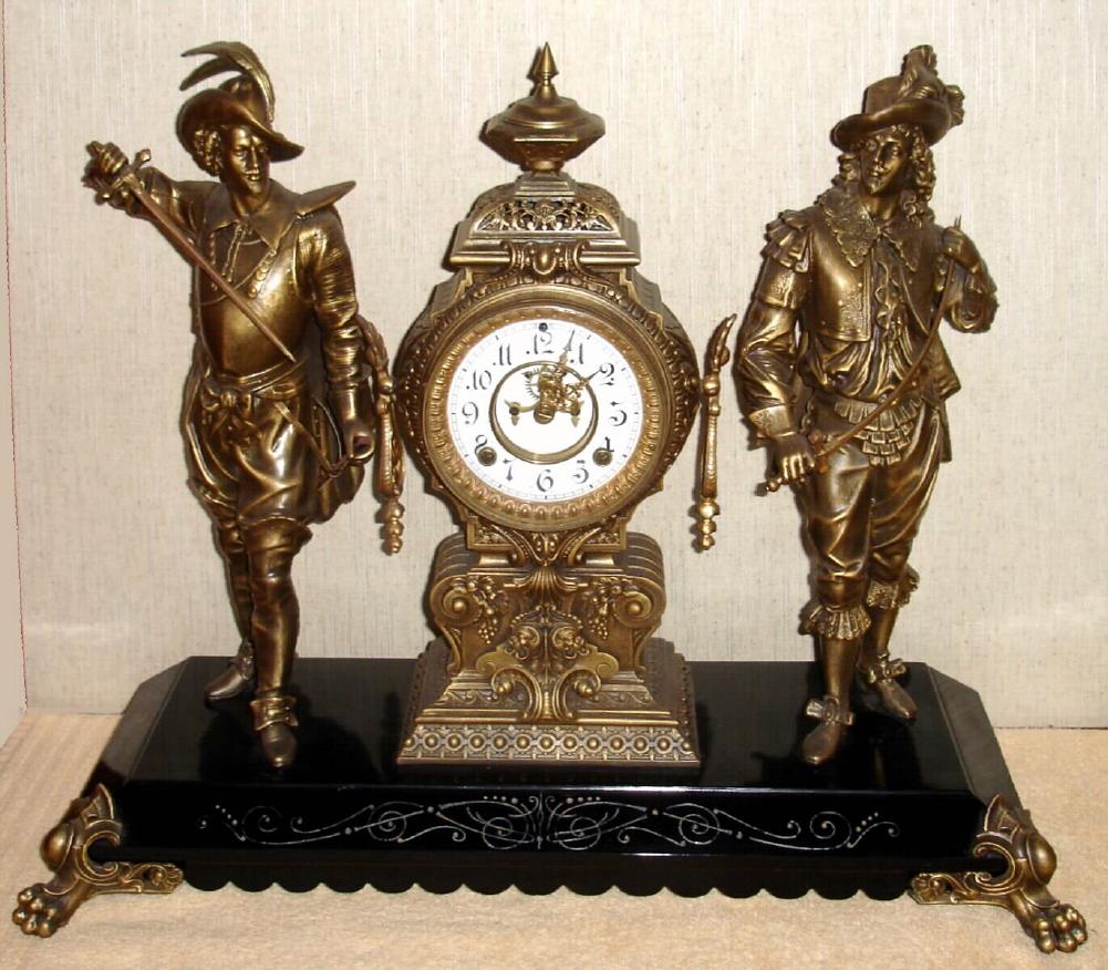 Ansonia Clock Co., New York, C.1880, "DON CAESAR and DON JUAN" double figure mantel clock, and with open escapement on porcelain dial. — Antique Clocks Price Guide