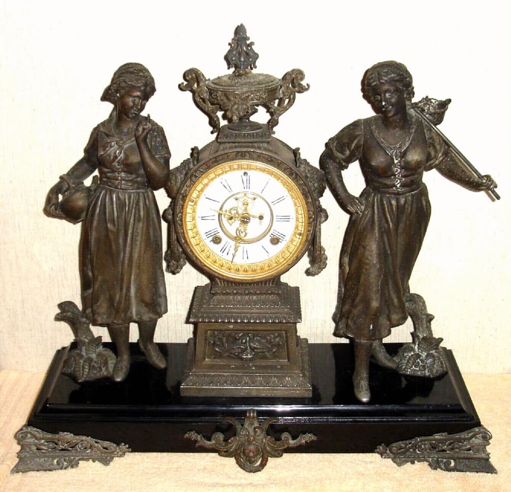 Ansonia Clock Co., New York, C.1880, "PEASANT GIRLS" double statue figural clock [rare model], with open escapement on porcelain dial, gong striking. — Antique Clocks Price Guide