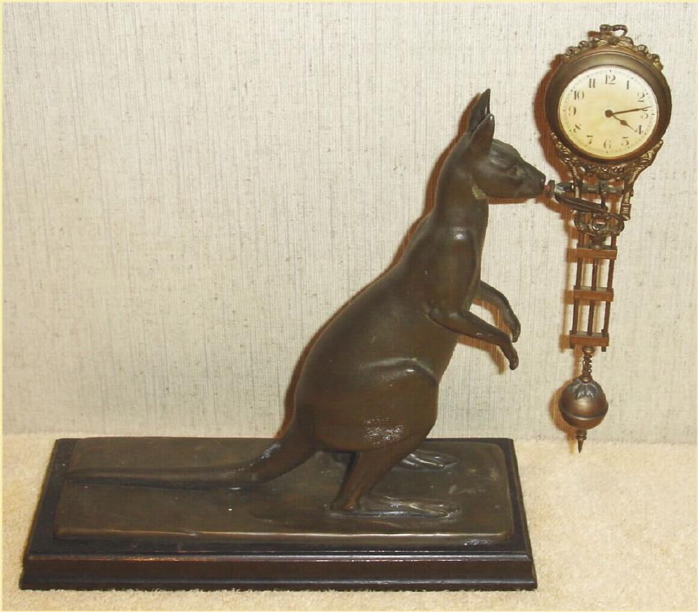 German, Junghans, C.1910, KANGAROO novelty swing clock, 8-day, time. The movement is contained in the top of the "clock arm" and the entire assembly swings from side to side on the nose of the Kangaroo. — Antique Clocks Price Guide