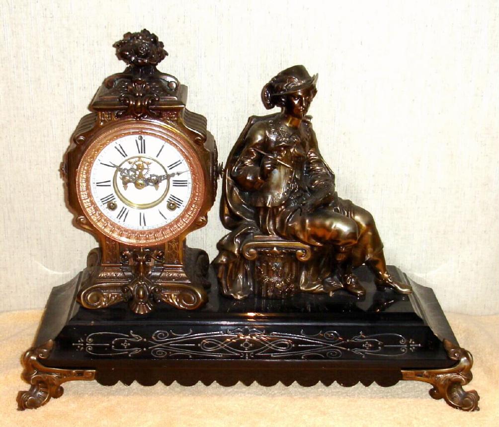 Ansonia Clock Co., New York, C.1894, "REUBENS", figural clock on an enameled iron base, the movement with open escapement on dial, 8-day gong striking. — Antique Clocks Price Guide