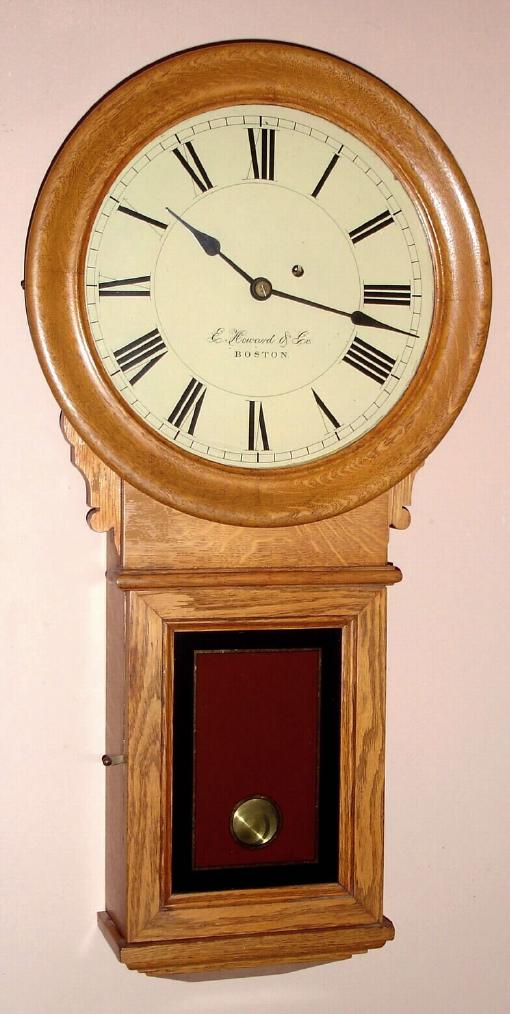 E. Howard and Co., Boston, "Regulator No. 70", Circa 1900, oak case round drop timepiece 8-day, weight driven. — Antique Clocks Price Guide