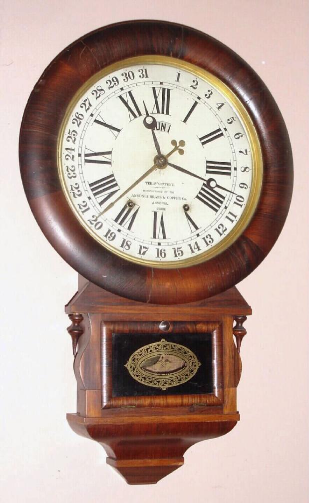 Ansonia Brass and Copper Co., "Drop Extra Calendar", Circa 1883, 8-day time/strike Terry's Patent wall calendar clock. — Antique Clocks Price Guide