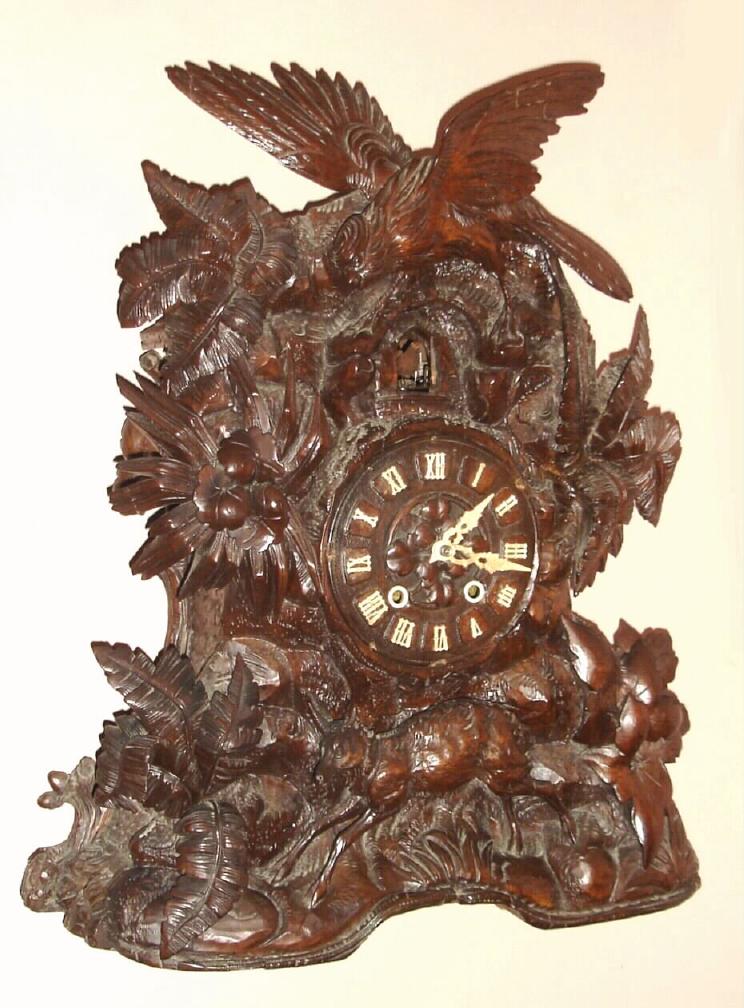 German, Large Black Forest shelf cuckoo, 2-fusee, brass mov't, 8-day duration, forest scene with deer at base and large cuckoo bird at top. — Antique Clocks Price Guide