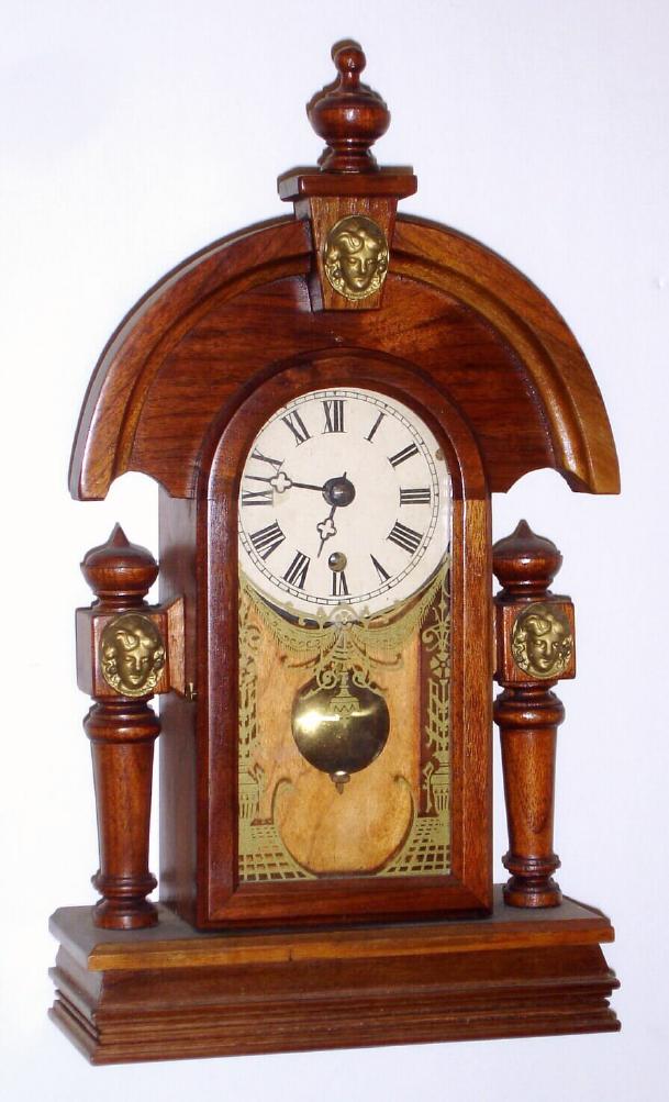 Jim Davis, Greensboro, NC, C.1975, miniature "teardrop" shelf clock, walnut cased with German 8-day time only mov't. — Antique Clocks Price Guide