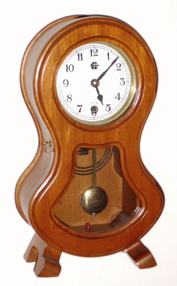 Westminster Clock Co, Korea, Modern, C.1980, small waisted case of light mahogany with a 30-day spring mov't with one at the hour strike [drop off]. — Antique Clocks Price Guide