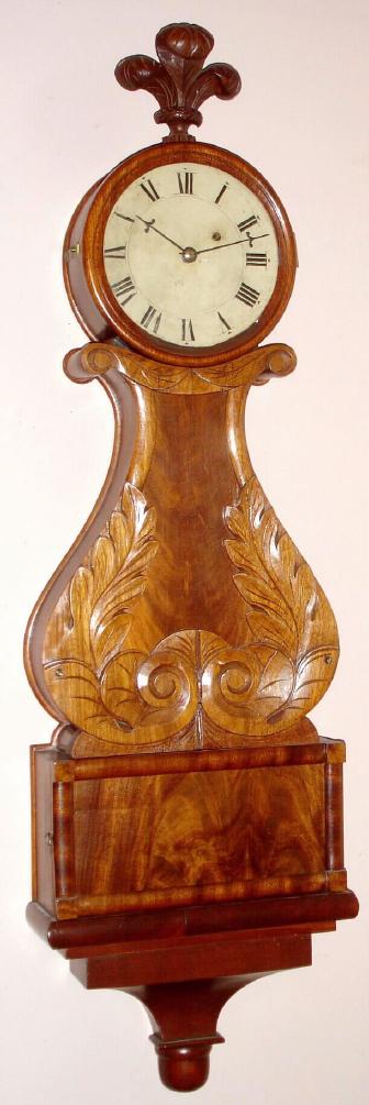 Massachusetts Lyre over Box banjo timepiece, C.1840, 8-day, weight driven, with carved mahogany front and blind lower door, with restorations. — Antique Clocks Price Guide