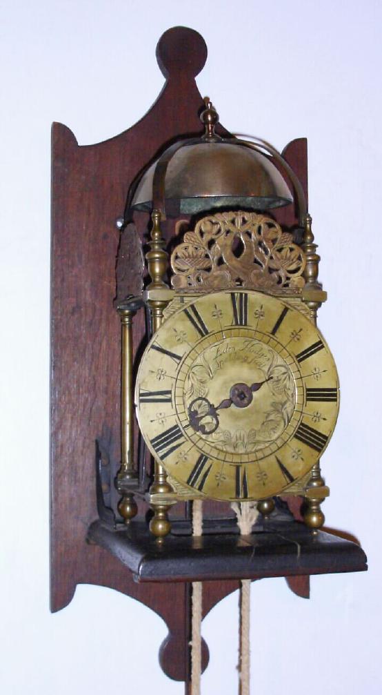 English, Edro. Hodges, C.1670, Lantern clock, single hand, bell strike, with meter pendulum + brass sheathed weight, also purpose made oak wall bracket. — Antique Clocks Price Guide