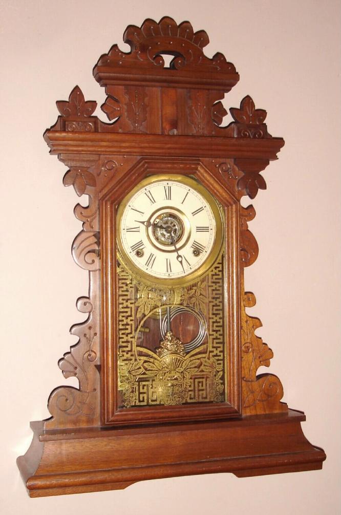 E. Ingraham Co., Bristol Conn. "PANSY" model mantel clock 8 day time, strike and alarm spring driven mvt in walnut case, c1890 — Antique Clocks Price Guide