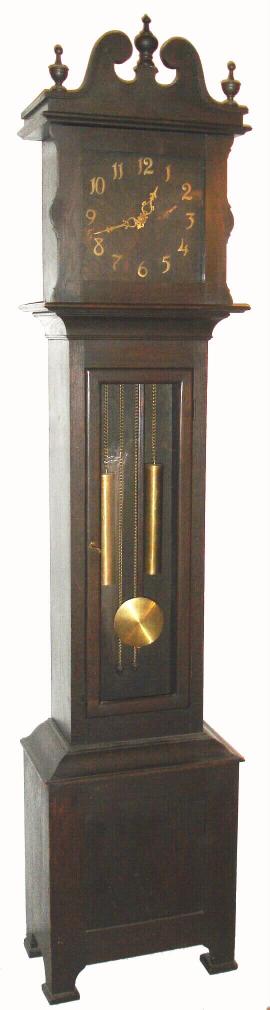 American, fumed oak tall case clock, probably by Ithaca Clock Co., 2-weight ladder chain movement striking on gong. C.1910. — Antique Clocks Price Guide
