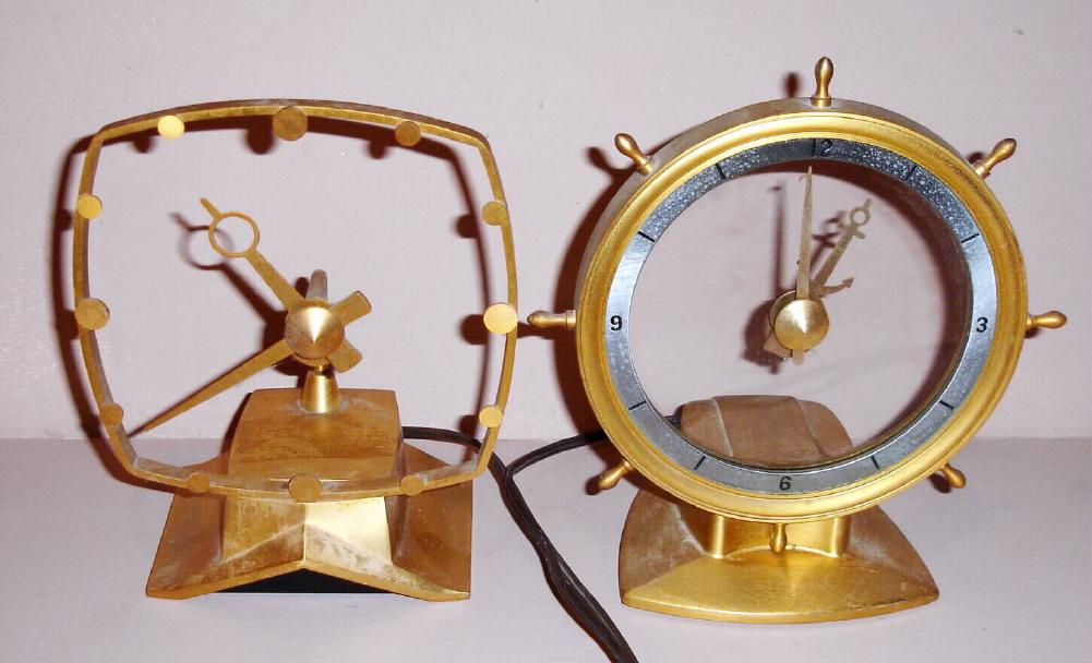 (2) Jefferson Electric Company, Bellwood Ill. "GOLDEN HELM" and "GOLDEN SECRET" models electric mystery clocks. Ht 7" and 8" — Antique Clocks Price Guide