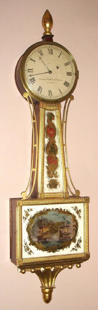 Massachusetts weight banjo timepiece, gold front w/ rope moldings, C.1830, and with the applied signature of Simon Willard and Sons, Boston, the eglomise tablets depicting the Constitution in battle during of the War of 1812. — Antique Clocks Price Guide