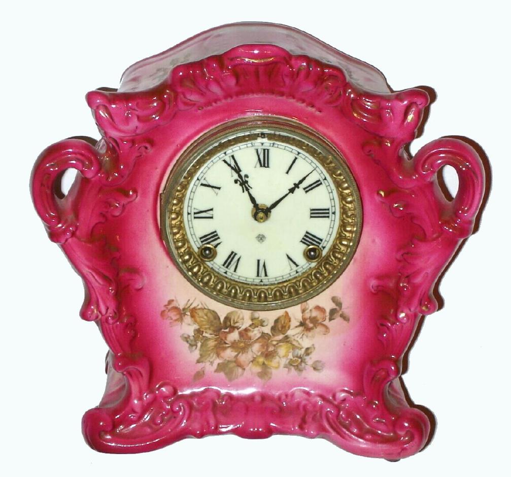 Ansonia Clock Co., Porcelain china clock, C.1900, standard line "WAG", in a darker pink color with floral decorations, restored. — Antique Clocks Price Guide