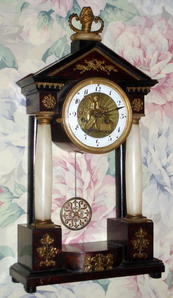 Austrian, 2-Day, time and strike mantel automaton, a cherub hammering at the anvil when the clock strikes, silk susp. — Antique Clocks Price Guide