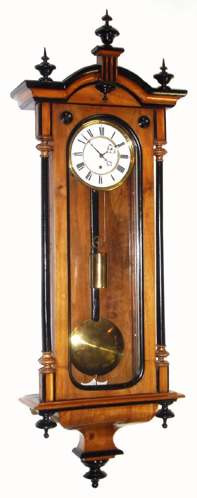 Austrian, 30-Day Vienna Regulator in a nice transitional case with smooth side columns, with ebonized accents. Has a good movement with Harrison's ratchet maintaining power. Remember to wind to the left. — Antique Clocks Price Guide