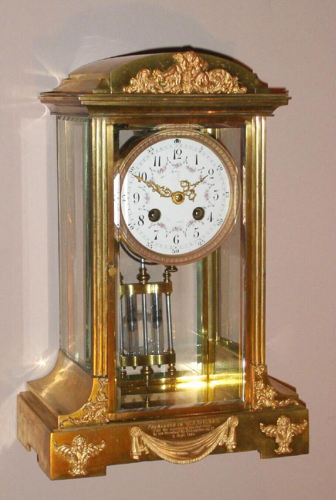 French, crystal regulator retailed by Henry Birks and Co, Montreal 8 day time/strike mvmt with the award medallion of Ls.Boname, Seloncourt, and 'Made in France', in a gilded brass case with Rococo style appliques and presentation on case front. and 2-vial compensating pendulum, c1903 — Antique Clocks Price Guide