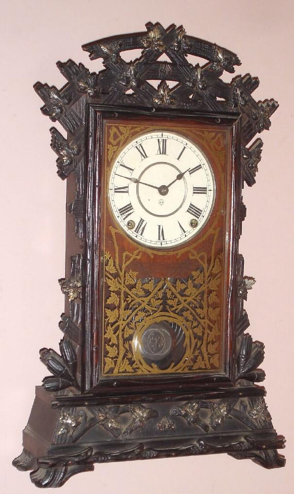 Seth Thomas Clock Co., rare "SANTA FE", city series walnut mantel clock, complete with all its metal leaves and damascene pendulum, 8-day with cathedral gong strike and lighter walnut dial surround. — Antique Clocks Price Guide