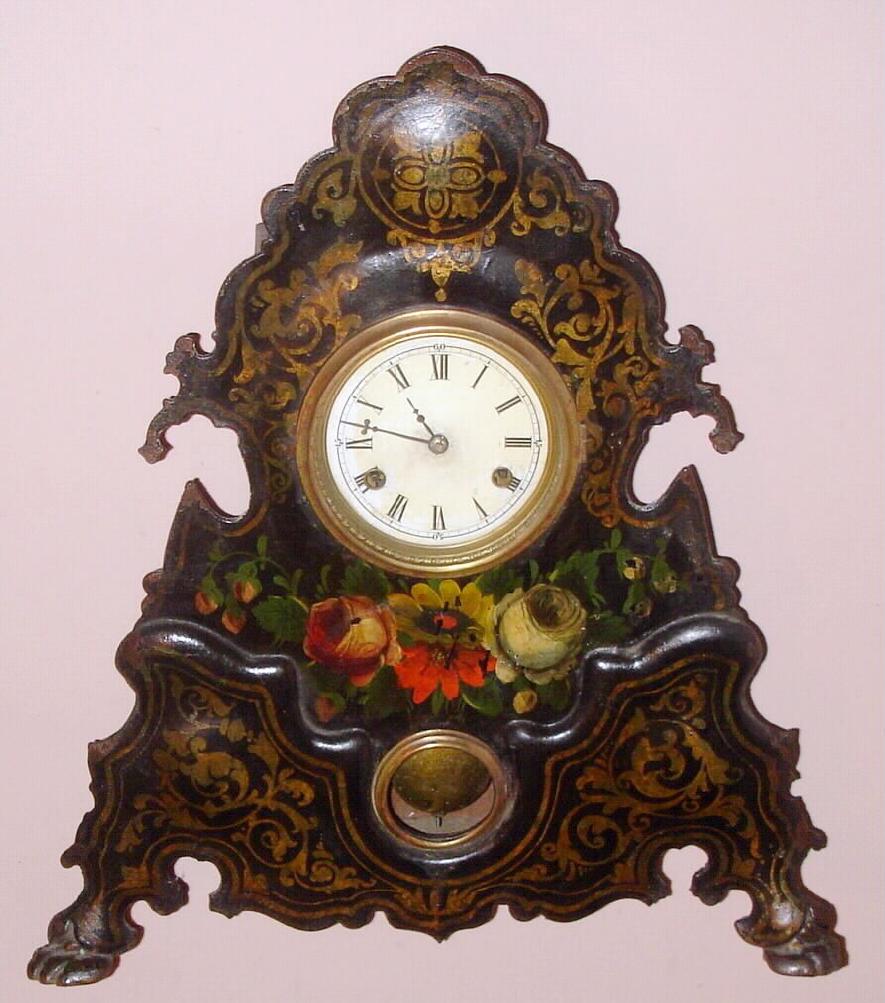 Unsigned, most likely American Clock Co., NY, large iron front, 30 hour, gong striking. This is the same iron case as shown in "A Treasury of American Clocks", pg 178, fig 395. The case would have been available to several Connecticut clock firms, C.1860 — Antique Clocks Price Guide