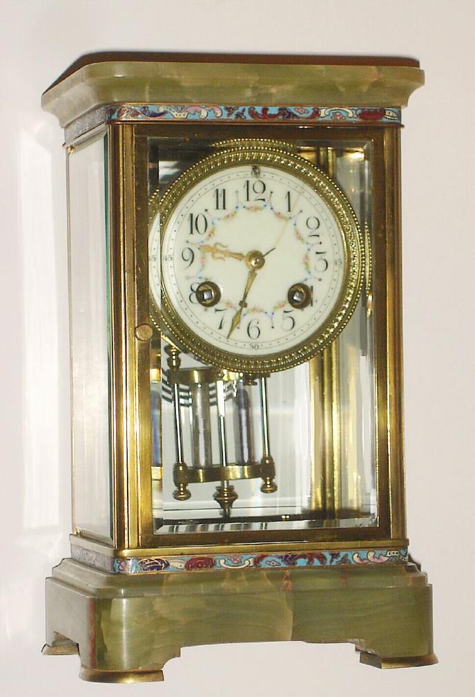 French, brass and glass 'Crystal' regulator, with green onyx top and base, and with bands bearing enamel inlay both top and bottom, and with a 2-vial compensating pendulum (intact). — Antique Clocks Price Guide