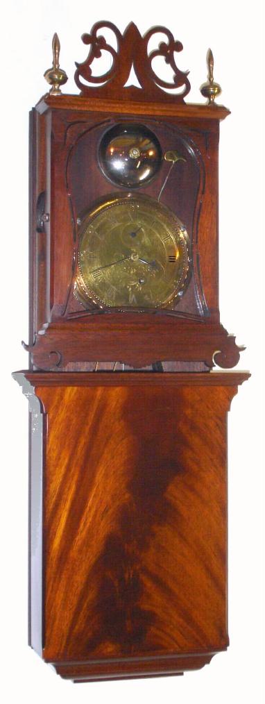 T. E. Burleigh, Jr, Winchester, Mass, reproduction "Grafton Wall Clock" in the manner of Aaron Willard, and the dial engraved with the Willard name, in a mahogany case made to the highest standards, C.1980, one bell at the hour passing strike, and seconds hand below 12, weight driven. — Antique Clocks Price Guide