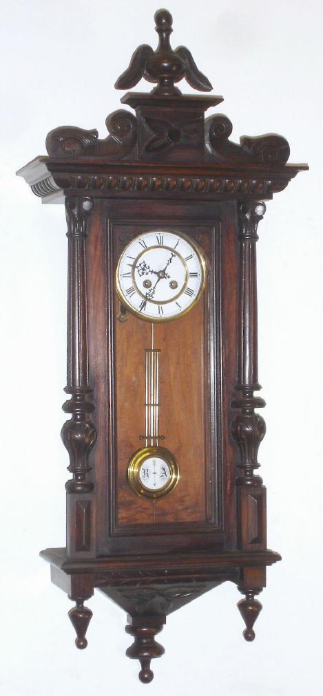 German, Kienzle, "R-A", Spring Driven wall regulator, in a walnut and walnut veneer case, and with R-A grid style pendulum, C.1900. — Antique Clocks Price Guide