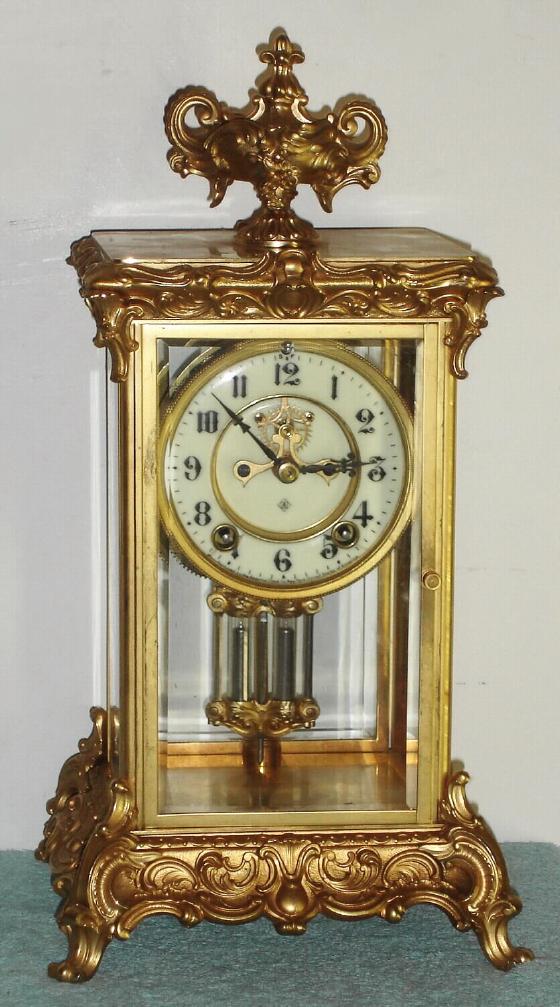 Ansonia Clock Co., "CROWN" 4-glass, crystal regulator, with open escapement on the dial, 8-day, gong strike, C.1914. — Antique Clocks Price Guide