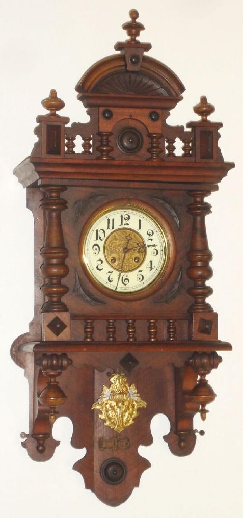German, Kienzle (Flying Dial Trademark), Berliner or 'Free Swinger', with a fancy cast brass pendulum, embossed dial center and porcelain chapter ring. — Antique Clocks Price Guide