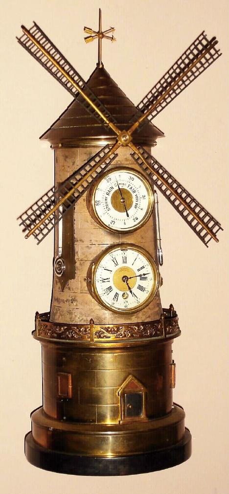 French, attributed to Guilmet retailed by Alibert, 222 Rue Rivoli, Paris, "WINDMILL", clock from the Industrial series, a time only spring driven movement in the tower with the mill blades turned by a cord traveling up the tower from a separate movement in the base and wound by opening the door of the mill in the base with a silvered Roman numeral chapter ring with an Aneroid barometer above the clock and two mercury thermometers, one Centigrade and one Fahrenheit, c1890 — Antique Clocks Price Guide