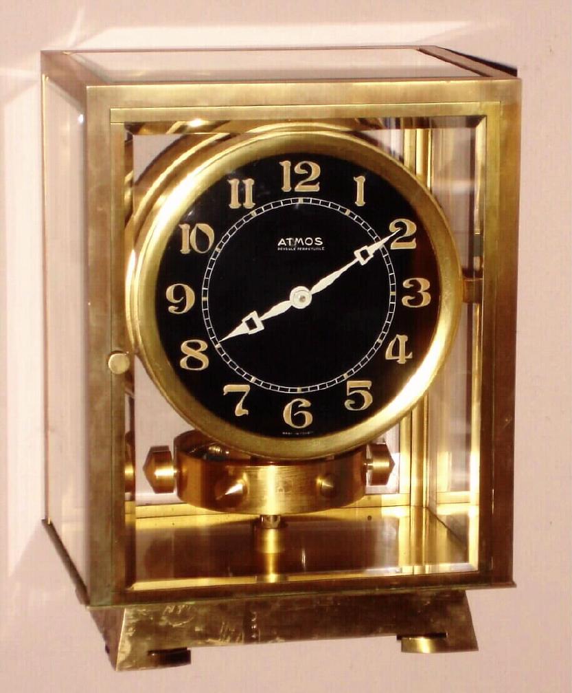 French, J.L. Reutter ATMOS clock, atmospheric driven time only movement with torsion pendulum designed using mercury inside a glass tube similar to that of a thermometer to react to sensitive changes in temperature and atmospheric conditions, Arabic numeral radium painted black dial, sNo. 3705 c1926 — Antique Clocks Price Guide