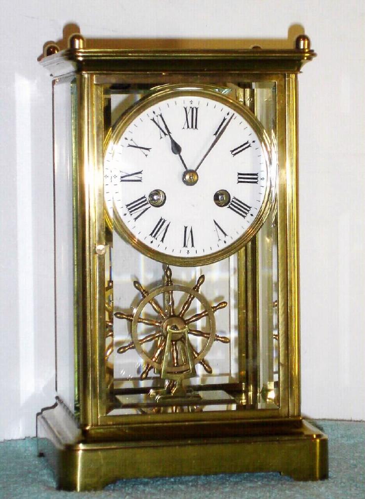French crystal regulator with ship's wheel pendulum, time and strike spring driven mvt and Roman numeral porcelain 3 1/2" dial, c1890 — Antique Clocks Price Guide