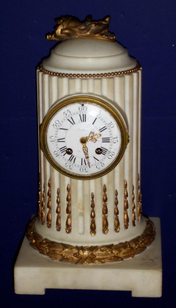 French, Japy Freres, Circa 1890, 8-day time/strike marble mantel clock, white marble in the form of a fluted column or monument, with ormolu trim. — Antique Clocks Price Guide