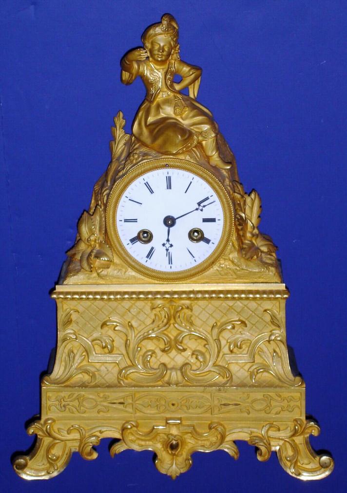 French, Circa 1850, 8-day time and bell strike figural mantel clock, gilt bronze, movement marked "Farret". — Antique Clocks Price Guide